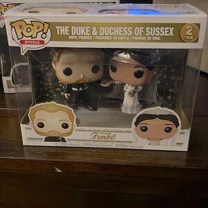 Meghan and Prince Harry funko pop.